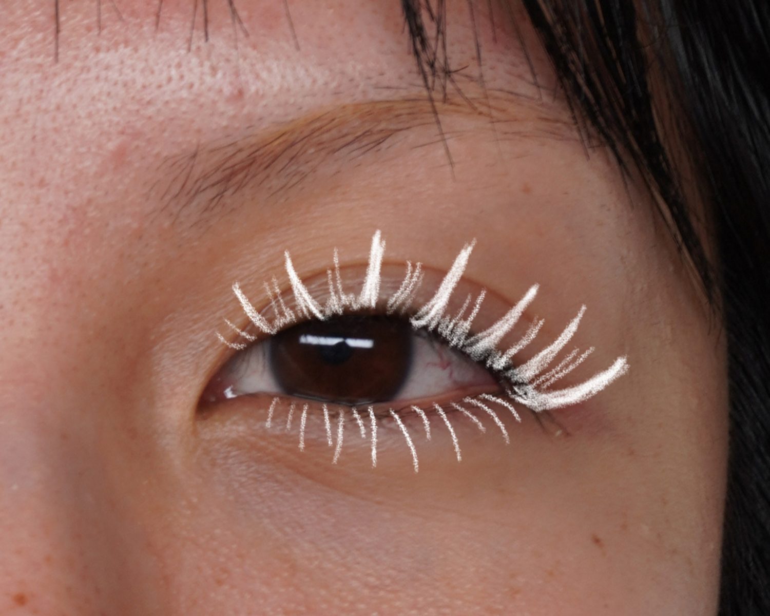 Samantha's lash mapping sketched in white over a client's eye